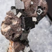 Bixbyite on Hematite after Garnet