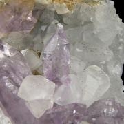 Amethyst (“reverse” scepters) on Calcite