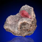 Rhodochrosite  on Quartz