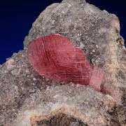 Rhodochrosite  on Quartz