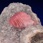 Rhodochrosite  on Quartz