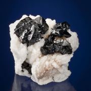 Cassiterite on Albite