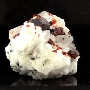 Spessartine Garnet, Orthoclase, Quartz, Tourmaline.