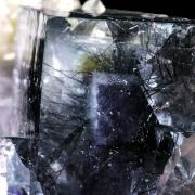 Fluorite included with Bismuthinite on Quartz