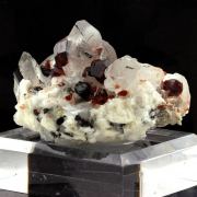 Spessartine Garnet, Orthoclase, Quartz, Tourmaline.