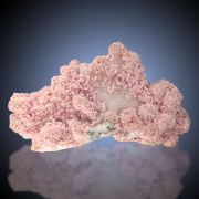 Rhodochrosite  on Quartz