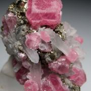 Rhodochrosite, Quartz on Pyrite