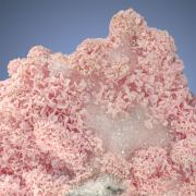 Rhodochrosite  on Quartz