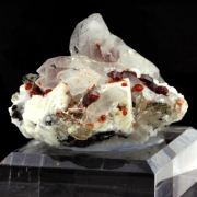 Spessartine Garnet, Orthoclase, Quartz, Tourmaline.