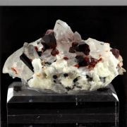 Spessartine Garnet, Orthoclase, Quartz, Tourmaline.