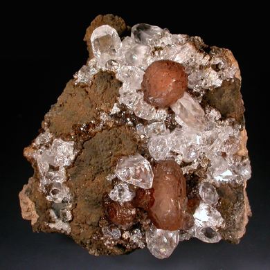 Olmiite with Calcite on Goethite