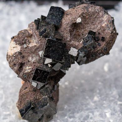 Bixbyite on Hematite after Garnet