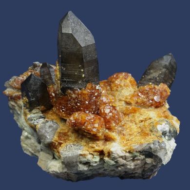 Spessartine garnet on Quartz (Smoky) with Orthoclase