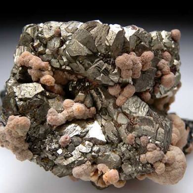 Rhodochrosite and Sphalerite on Pyrite psuedo. Pyrrhotite