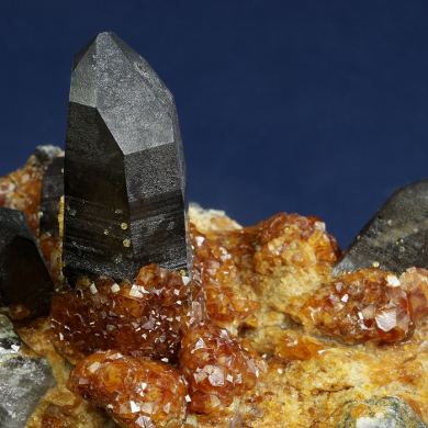 Spessartine garnet on Quartz (Smoky) with Orthoclase