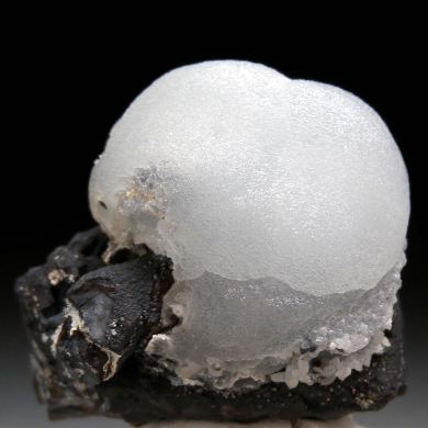 Smithsonite on Coronadite